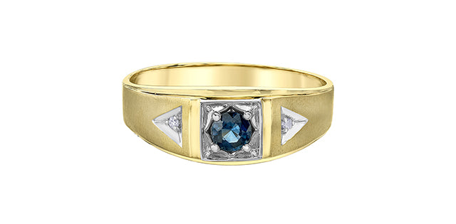Gold ring with a blue gemstone and triangular designs on a white background Fifth Avenue Jewellers Kamloops BC