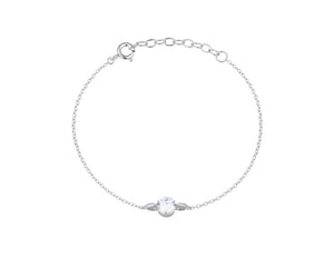 Silver bracelet with a small round CZ pendant on a white background