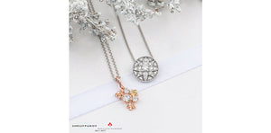 Silver necklace with a star pendant on a white background