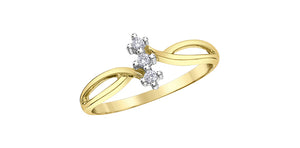 Gold ring with diamond accents on a white background
