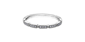 White gold ring with small diamonds on a white background