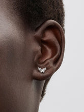 Load image into Gallery viewer, Butterfly-shaped earring worn on an ear with a neutral background
