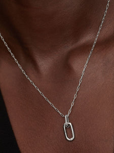 Silver necklace with an openable link on a model