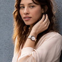 Load image into Gallery viewer, Woman wearing a watch with a neutral background
