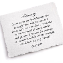 Load image into Gallery viewer, White card with engraved text about recovery and a phoenix symbol, branded &#39;pyrrha&#39;.
