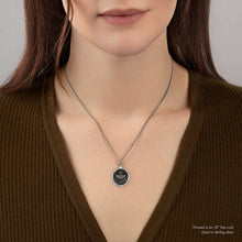 Load image into Gallery viewer, Person wearing a necklace with a pendant on a plain background
