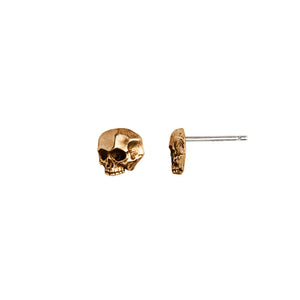 Bronze skull-shaped earrings on a white background