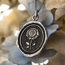 Load image into Gallery viewer, Silver pendant with sunflower design on a floral background
