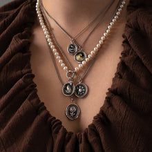 Load image into Gallery viewer, Model wearing layered talismans
