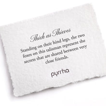 Load image into Gallery viewer, White card with talisman description and Pyrrha branding
