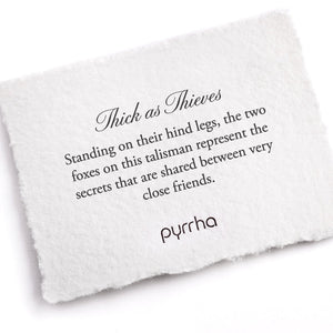White card with talisman description and Pyrrha branding