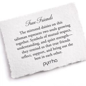 White card with engraved text about true friends and pyrrha brand