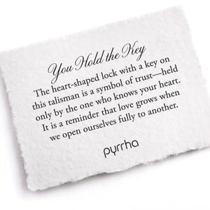 White card with engraved text and 'pyrrha' branding on a white background