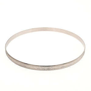Faceted And Diamond Cut Bangle In White Gold - Fifth Avenue Jewellers