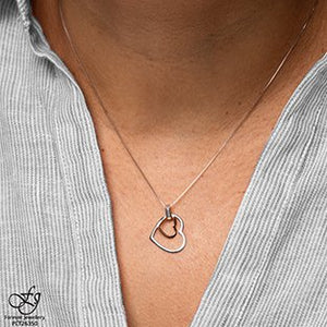 Tilted Double Heart Pendant Necklace With Diamond Accent - Fifth Avenue Jewellers